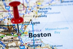 A red push pin marks Boston on a map